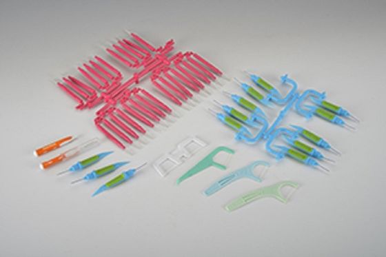Máquina de moldeo por inyección de plástico rotativo vertical de 55 toneladas utilizada para el hilo dental